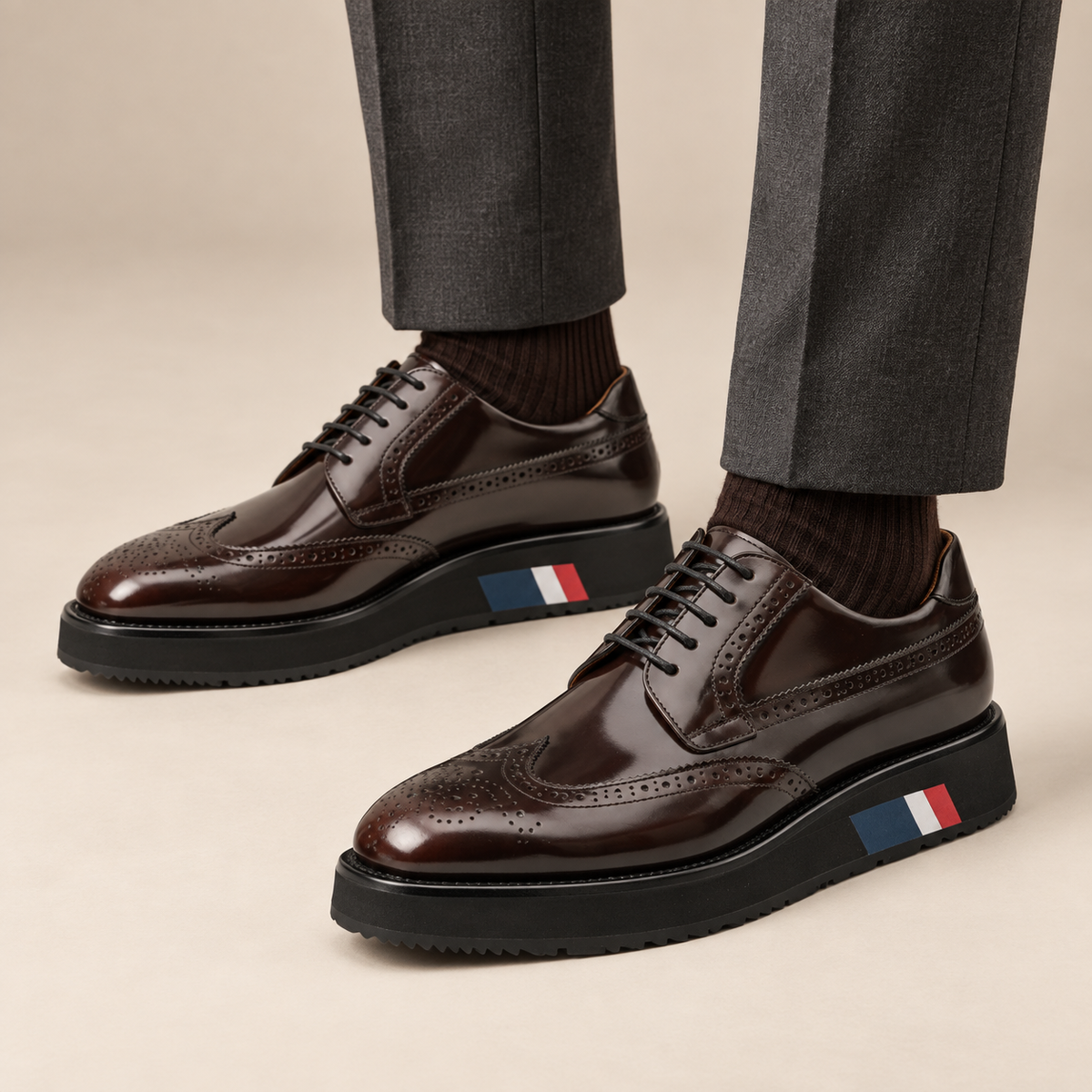 Dark brown platform wingtip Derby shoes — balanced premium on-foot studio view