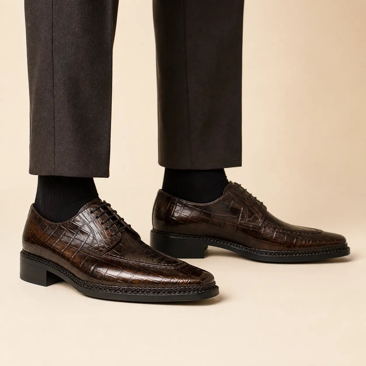 DIVINCH espresso crocodile apron Derby on foot — warm studio side profile