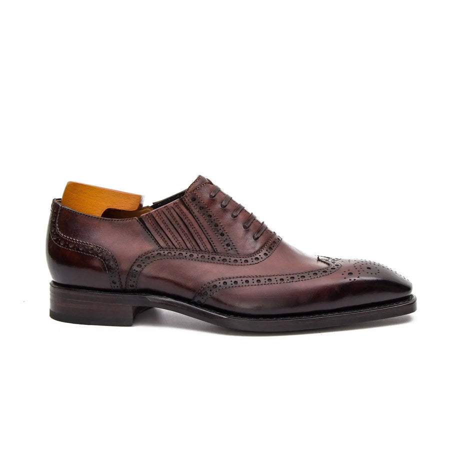 Scarpa Oxford bordeaux con motivo brogue