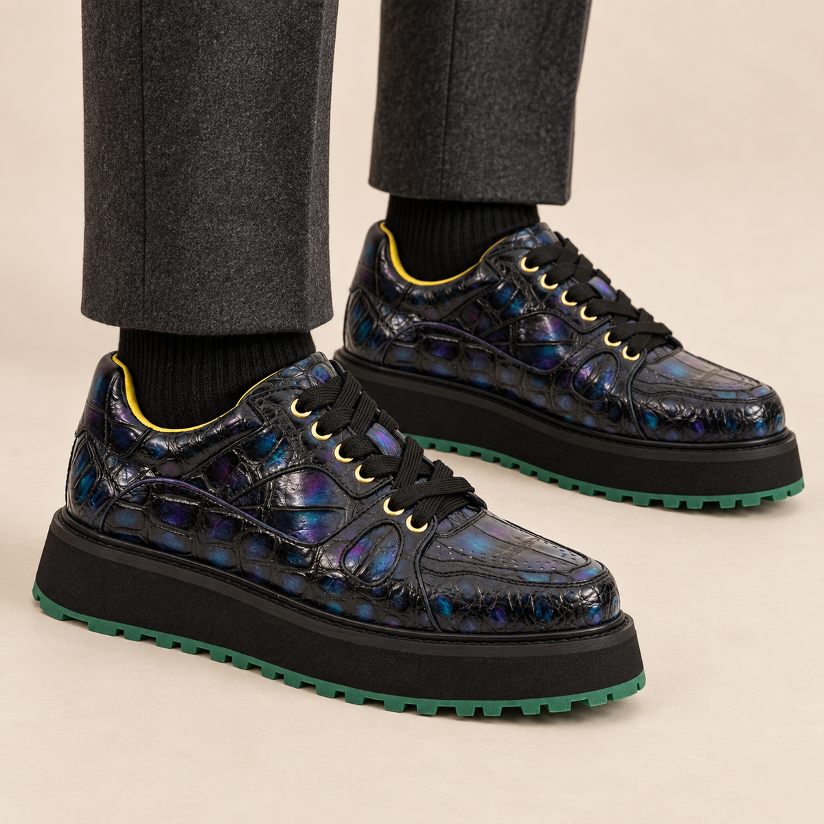 Iridescent blue-black platform sneakers worn with dark socks