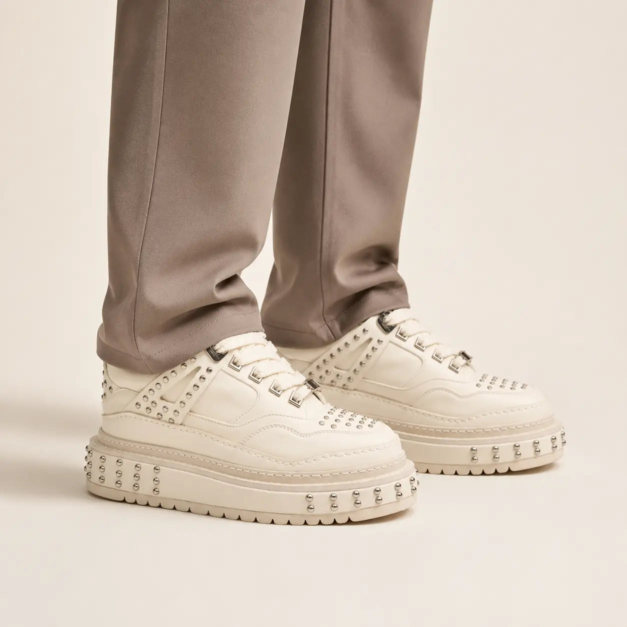 Ivory Studded Platform Sneaker — on-foot studio view