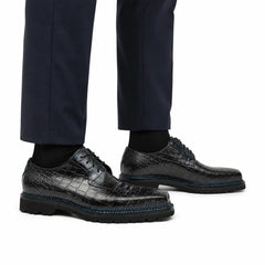 Midnight crocodile Derby shoes on foot
