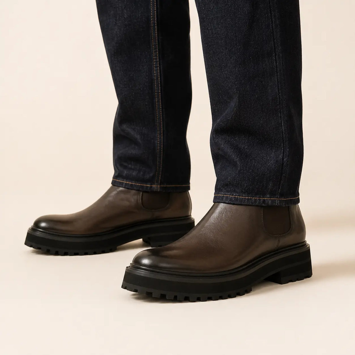 Minimal Espresso Chelsea Lug Boot worn with raw indigo denim