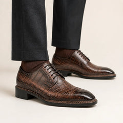 DIVINCH mocha crocodile Norwegian Derby on foot — warm studio side profile