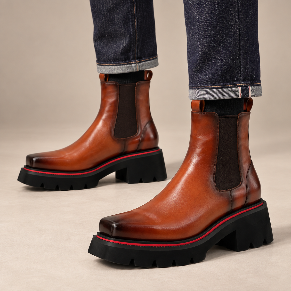 Orange-shaded brown Chelsea ankle boots on foot