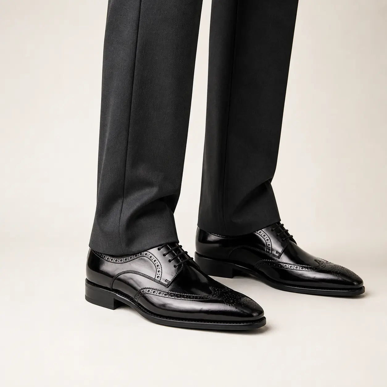 Polished Black Calf Derby on foot, warm off-white studio
