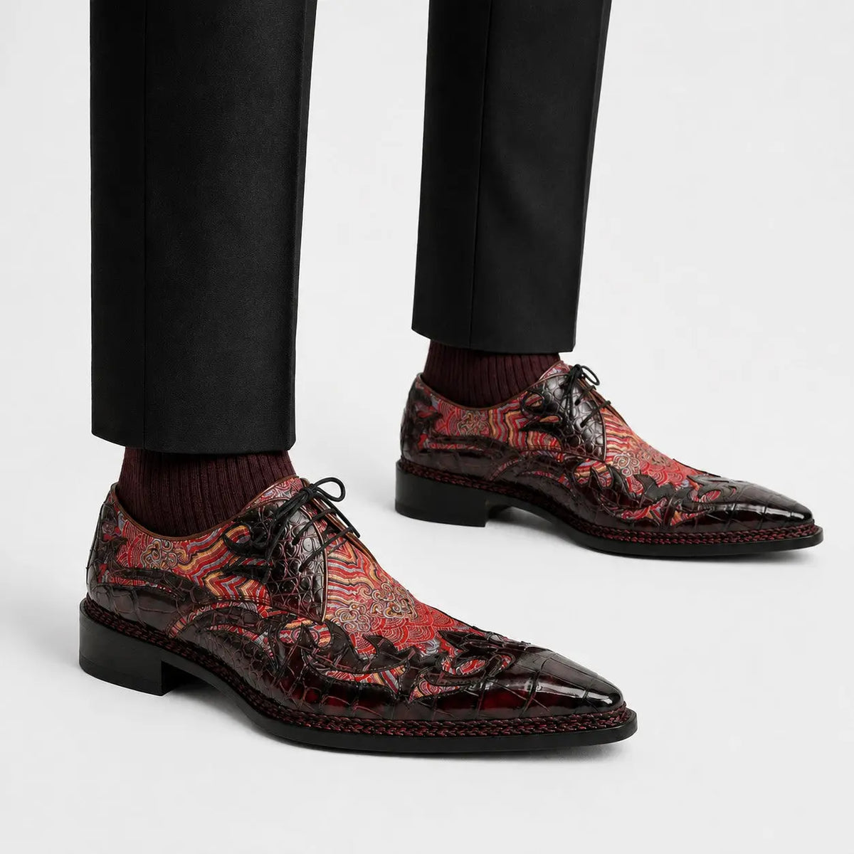 Bordeaux patterned crocodile Derby shoes on foot