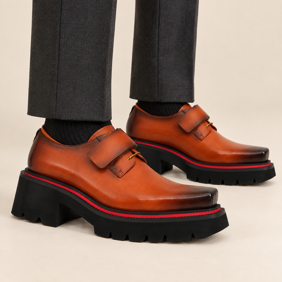Orange-brown platform square-toe strap shoes on foot
