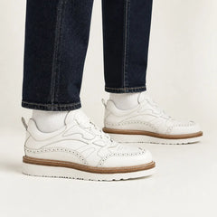 White brogue hybrid sneakers on foot