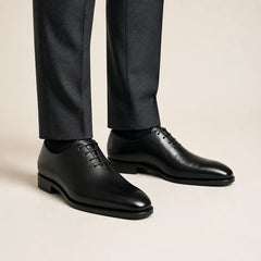 Wholecut Black Oxford — on-foot studio view
