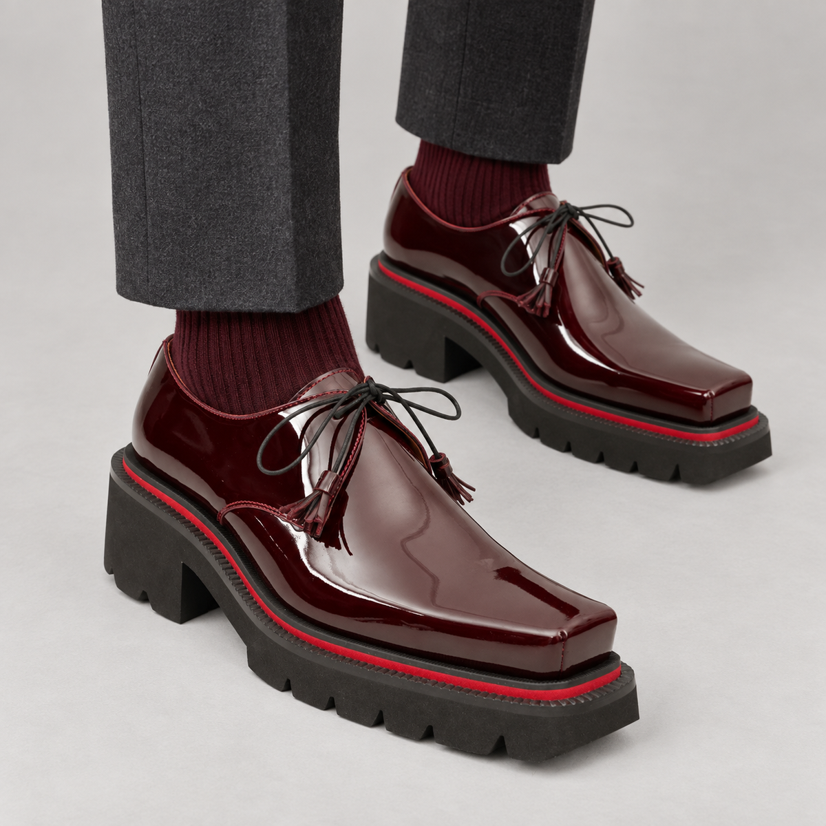 Burgundy patent square-toe Derby shoes on foot
