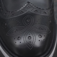 Black Glossy Lug-Sole Wingtip Ankle Boot with Rear Pull Tab